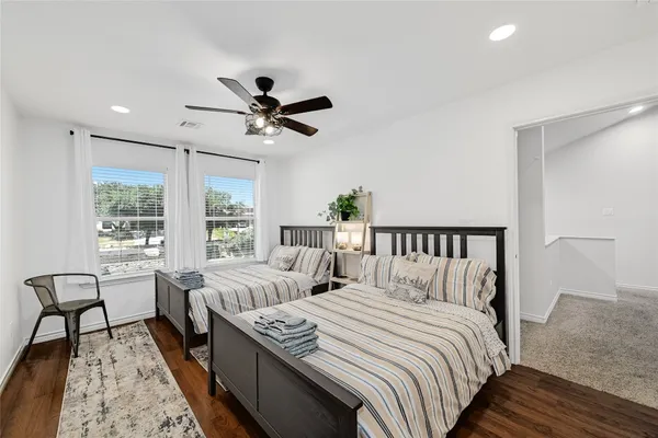 a bedroom with double bed and a window