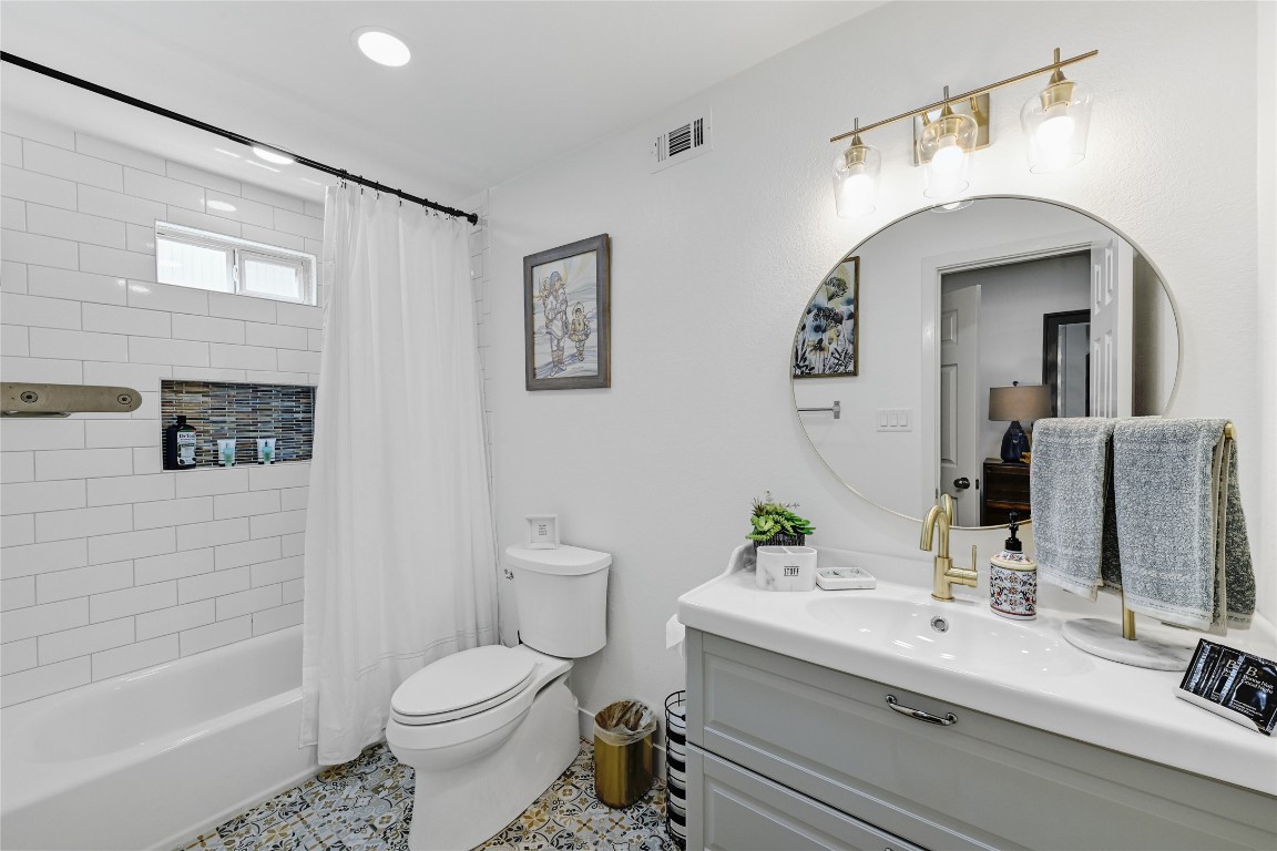 225 Comanche Lane Point Venture, TX 78645 - Photo 31 of 40 a bathroom with a sink toilet and shower