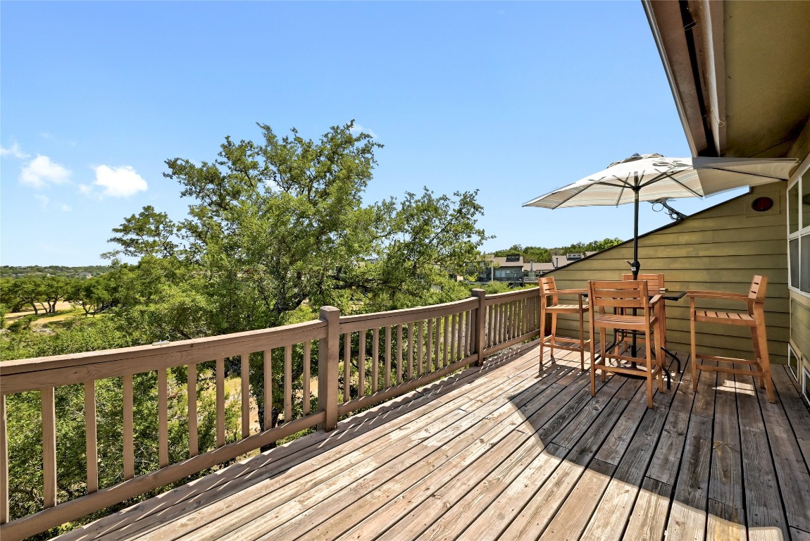 225 Comanche Lane Point Venture, TX 78645 - Photo 35 of 40 a view of balcony with furniture and wooden floor