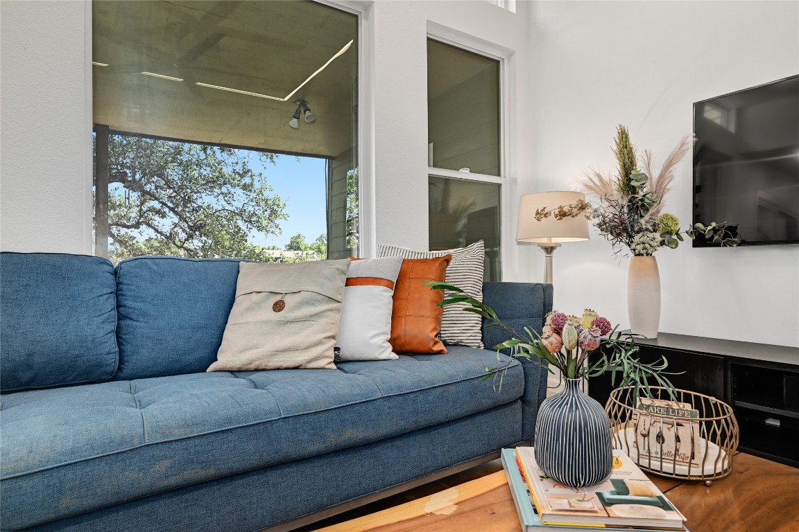 225 Comanche Lane Point Venture, TX 78645 - Photo 7 of 40 a living room with furniture potted plant and a large window