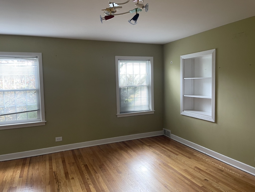 791 Braeburn Road Inverness, IL 60067 - Photo 12 of 14 a view of empty room with wooden floor and fan