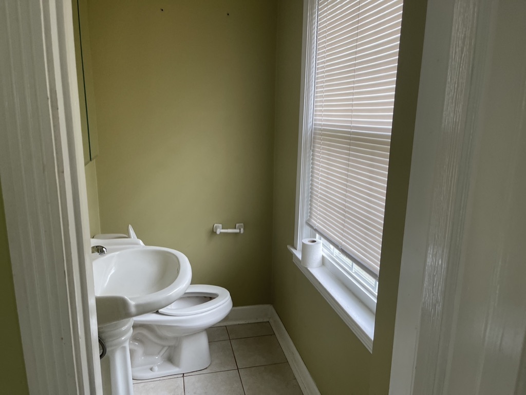 791 Braeburn Road Inverness, IL 60067 - Photo 7 of 14 a white toilet sitting next to a window