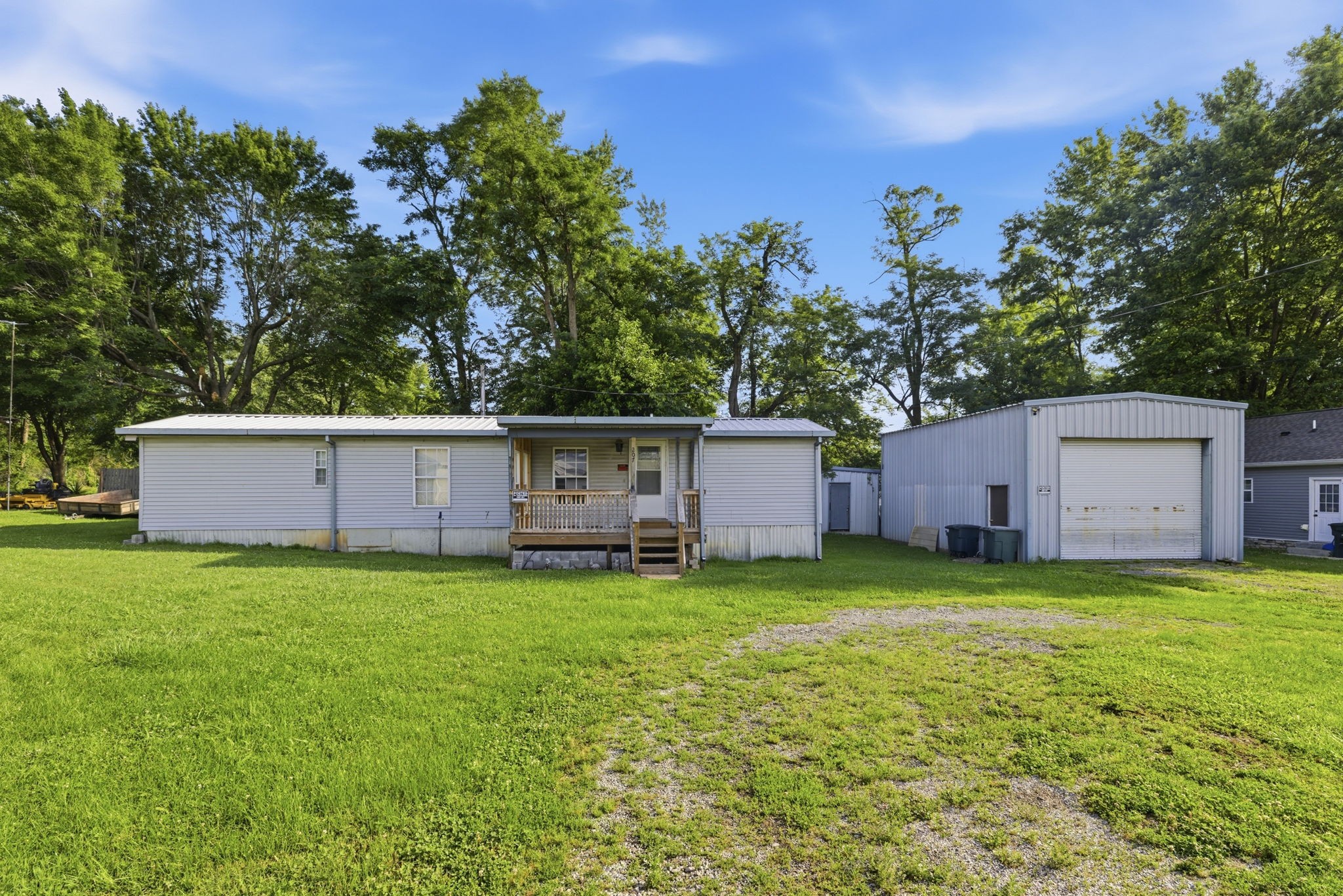 207 Center Street Portland, TN 37148 - Photo 23 of 26 a backyard of a house with table and chairs