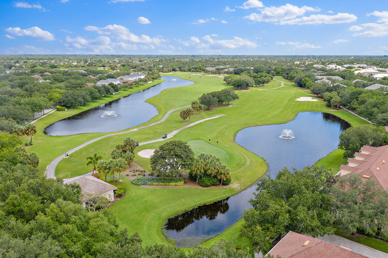 107 Rivinia Drive Jupiter, FL 33458 - Photo 27 of 28 an aerial view of residential houses with outdoor space and lake view