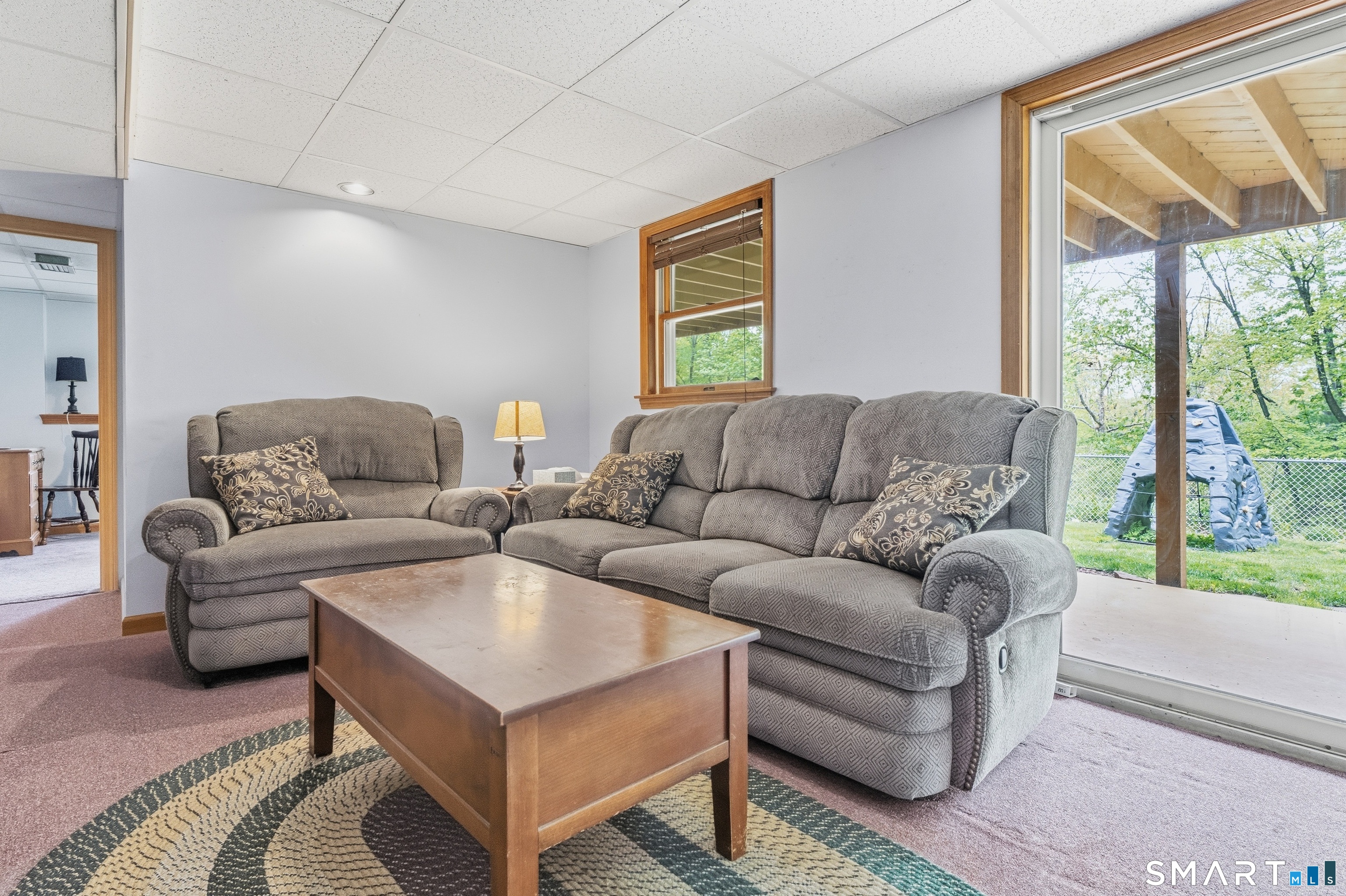 877 Newgate Road Suffield, CT 06093 - Photo 38 of 40 a living room with furniture and a large window