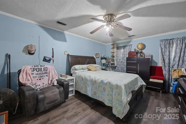 a bedroom with bed and window