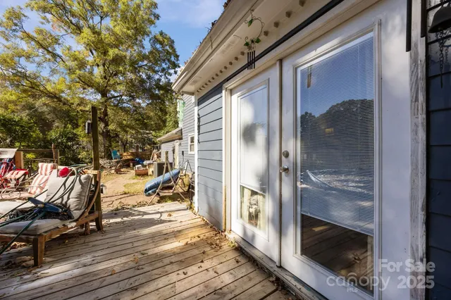 a view of living room kitchen and entryway