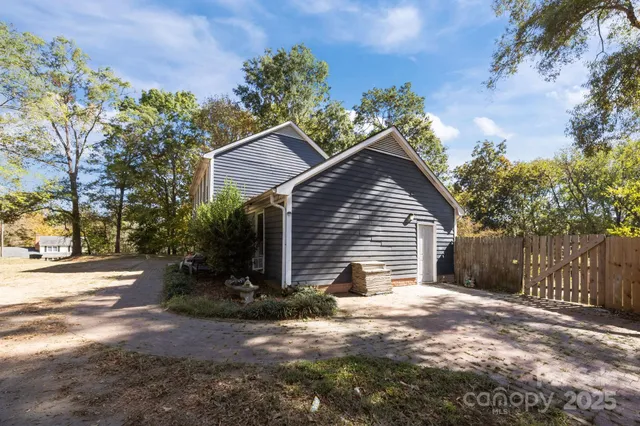 a view of a house with a yard and plants
