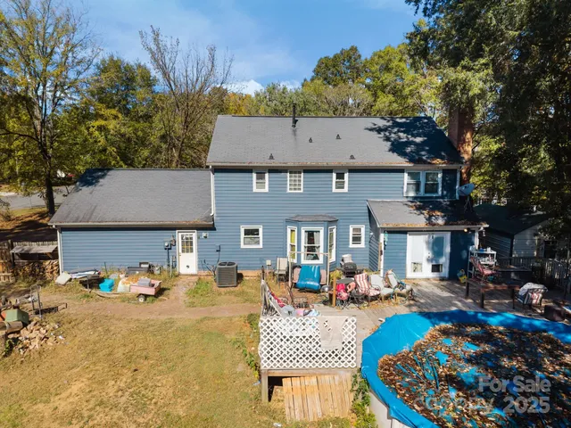 a front view of a house with sitting area