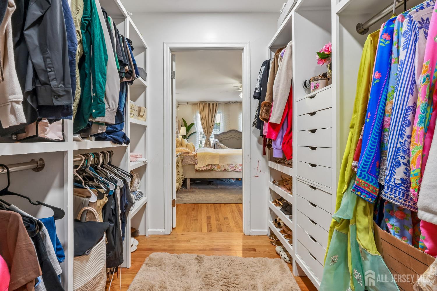 489 Plainfield Road Edison, NJ 08820 - Photo 24 of 39 a view of walk in closet with clothes and shoes