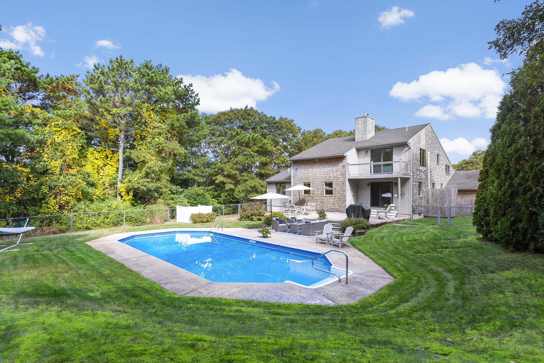21 Eldridge Street Buzzards Bay, MA 02532 - Photo 27 of 40 a view of pool with lawn chairs and a big yard