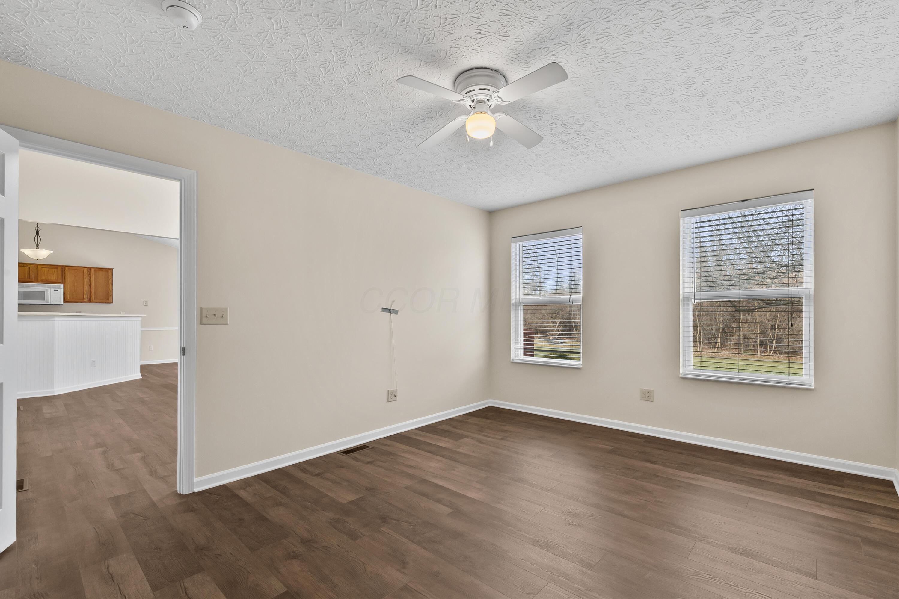 30 Tabilore Loop Delaware, OH 43015 - Photo 28 of 55 • New luxury vinyl plank flooring ~ 2025 • Tan painted walls • Lighted ceiling fan • Linen closet with sliding doors • 2” blinds