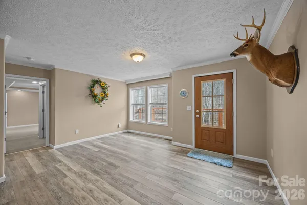 an empty room with windows and closet