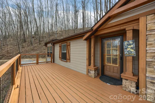 a view of outdoor space with deck and barbeque oven