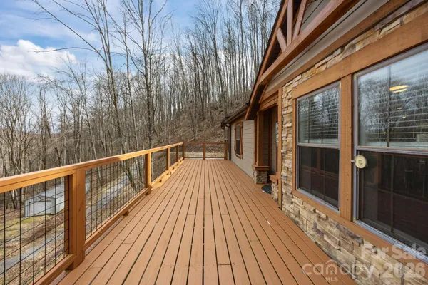a view of balcony with wooden floor