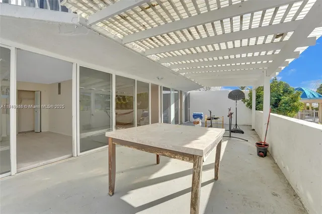 a room with a table and chairs