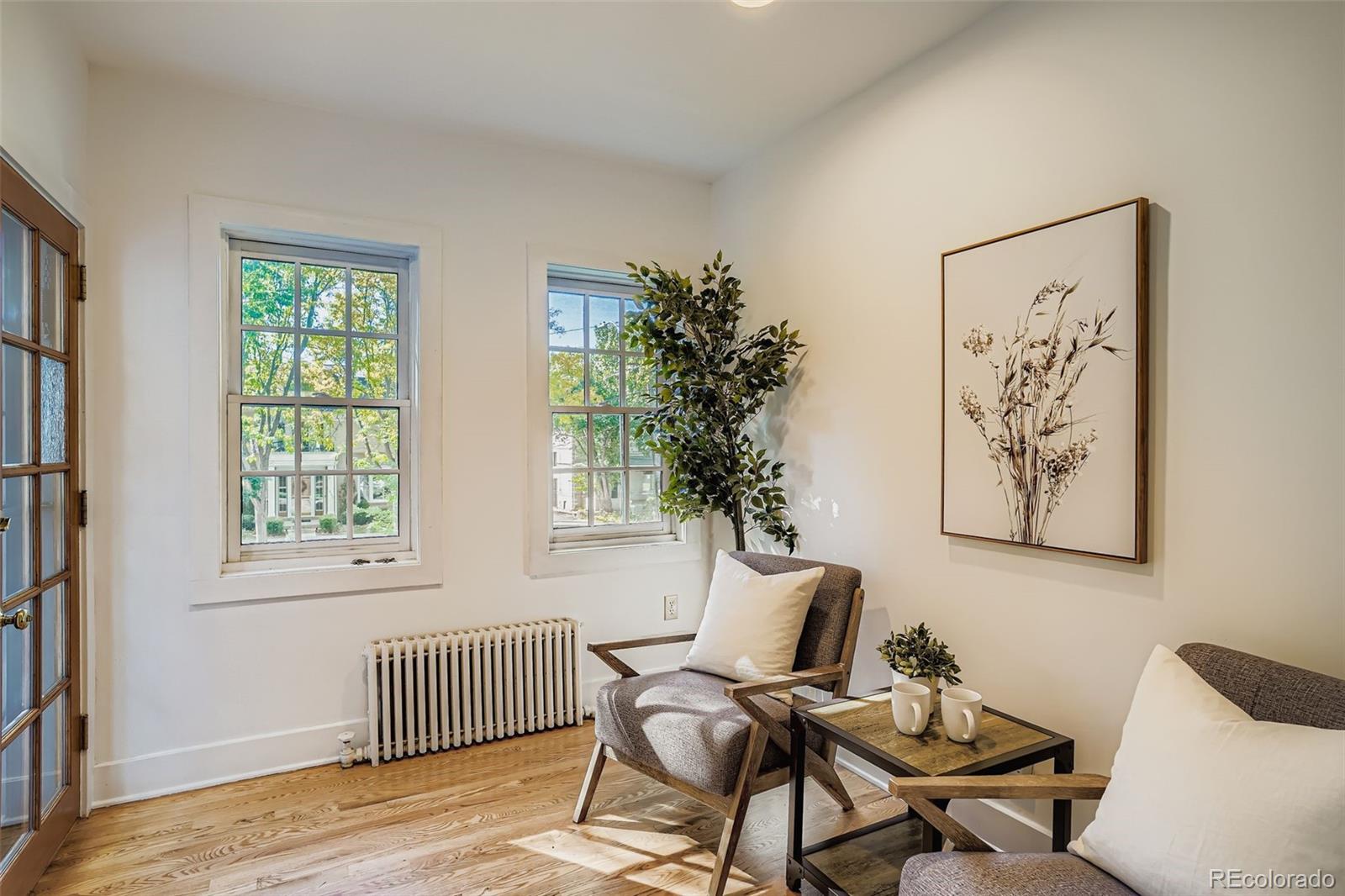 707 Corona Street Denver, CO 80218 - Photo 11 of 46 a living room with furniture and a window