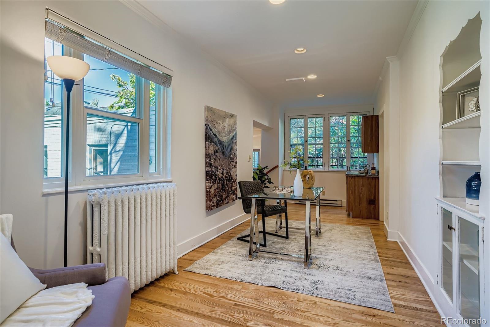 707 Corona Street Denver, CO 80218 - Photo 12 of 46 a living room with furniture and a window