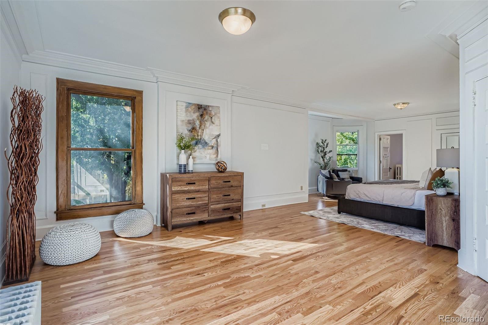 707 Corona Street Denver, CO 80218 - Photo 20 of 46 a living room with furniture and a wooden floor