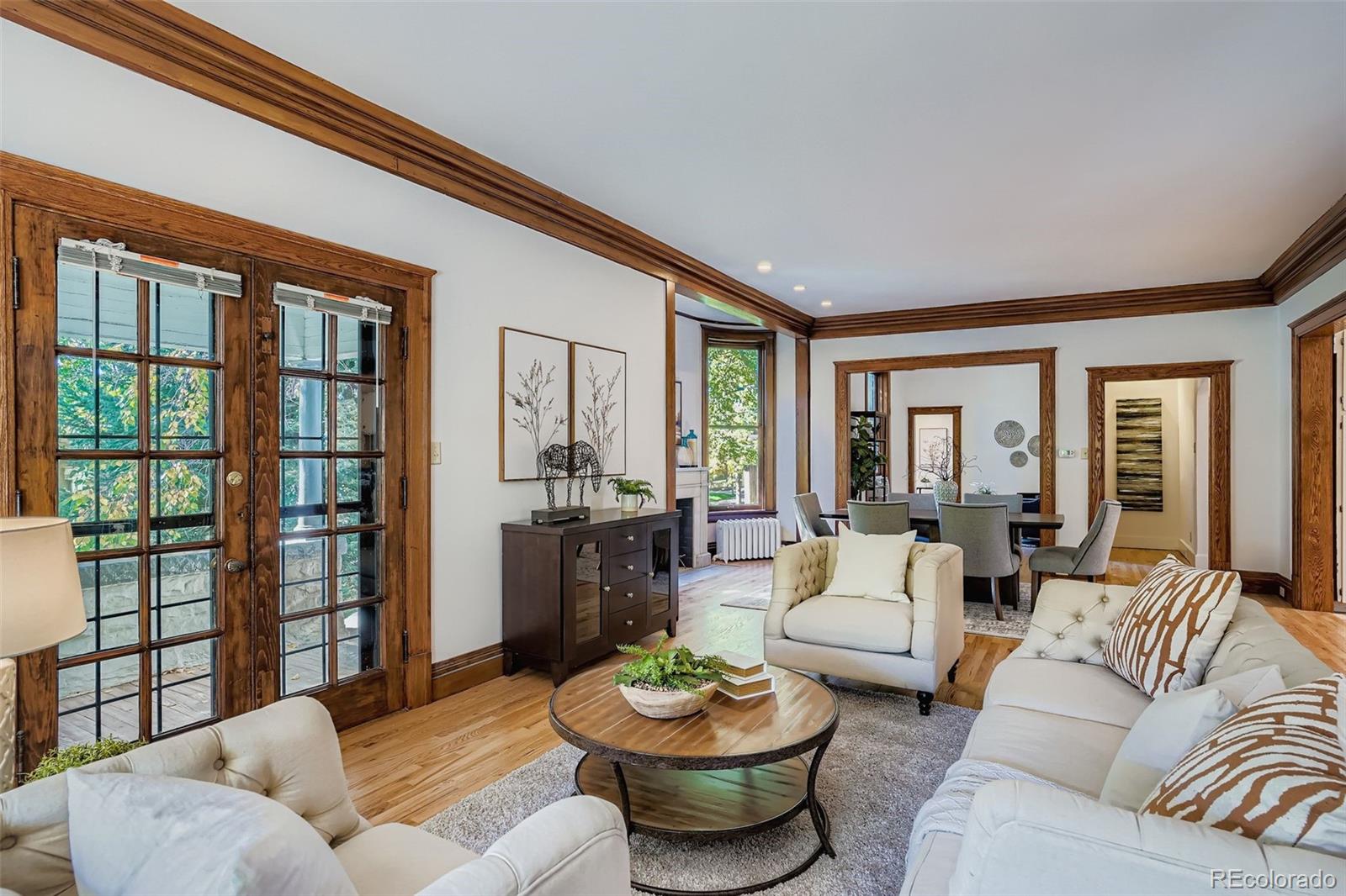 707 Corona Street Denver, CO 80218 - Photo 2 of 46 a living room with furniture and a large window