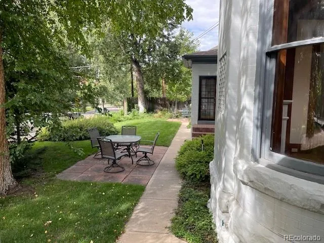 a view of a house with balcony and garden