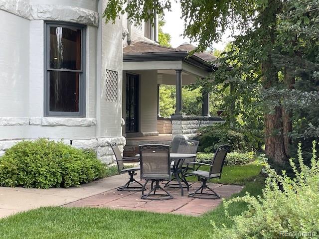 707 Corona Street Denver, CO 80218 - Photo 41 of 46 a view of a chair and table in backyard of the house