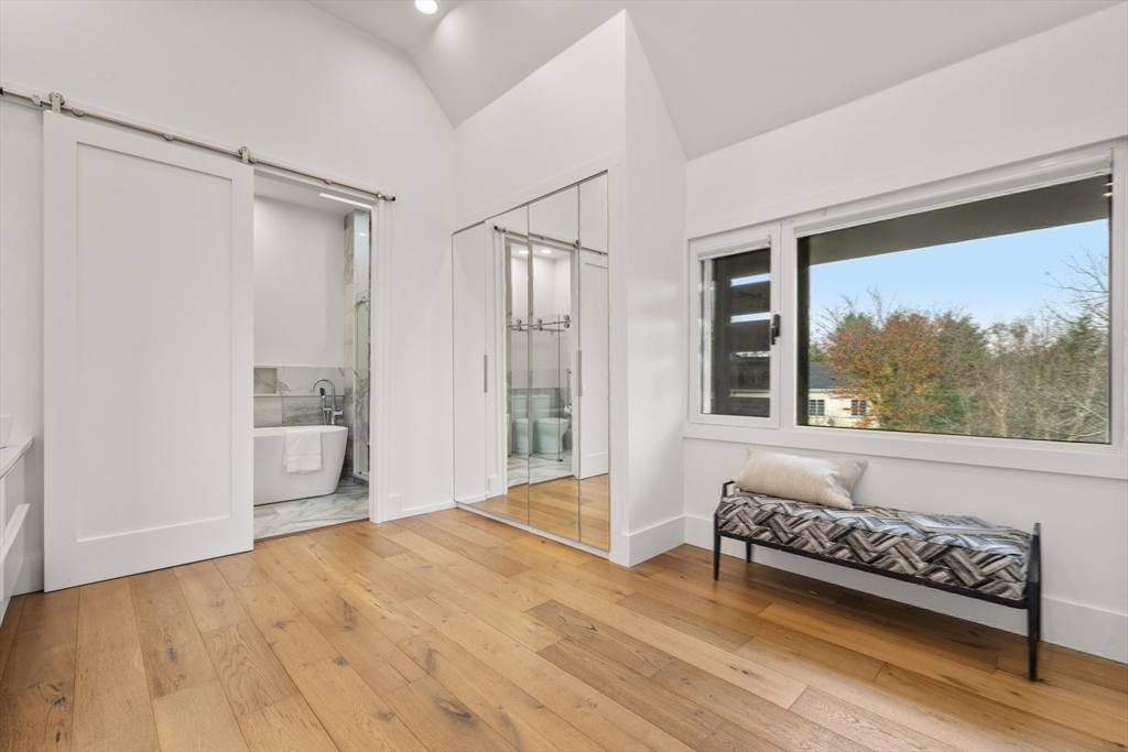 30 Whipple Road Lexington, MA 02420 - Photo 20 of 32 a spacious bedroom with a bed and a window
