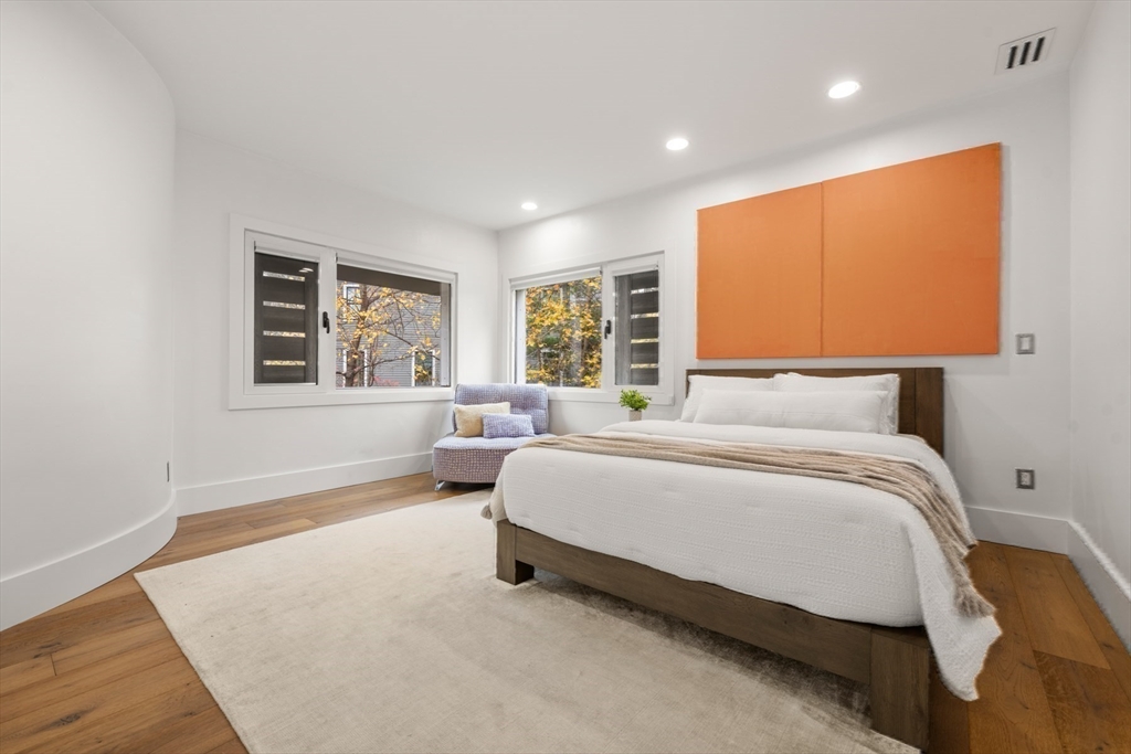 30 Whipple Road Lexington, MA 02420 - Photo 25 of 32 a spacious bedroom with a bed and wooden floor