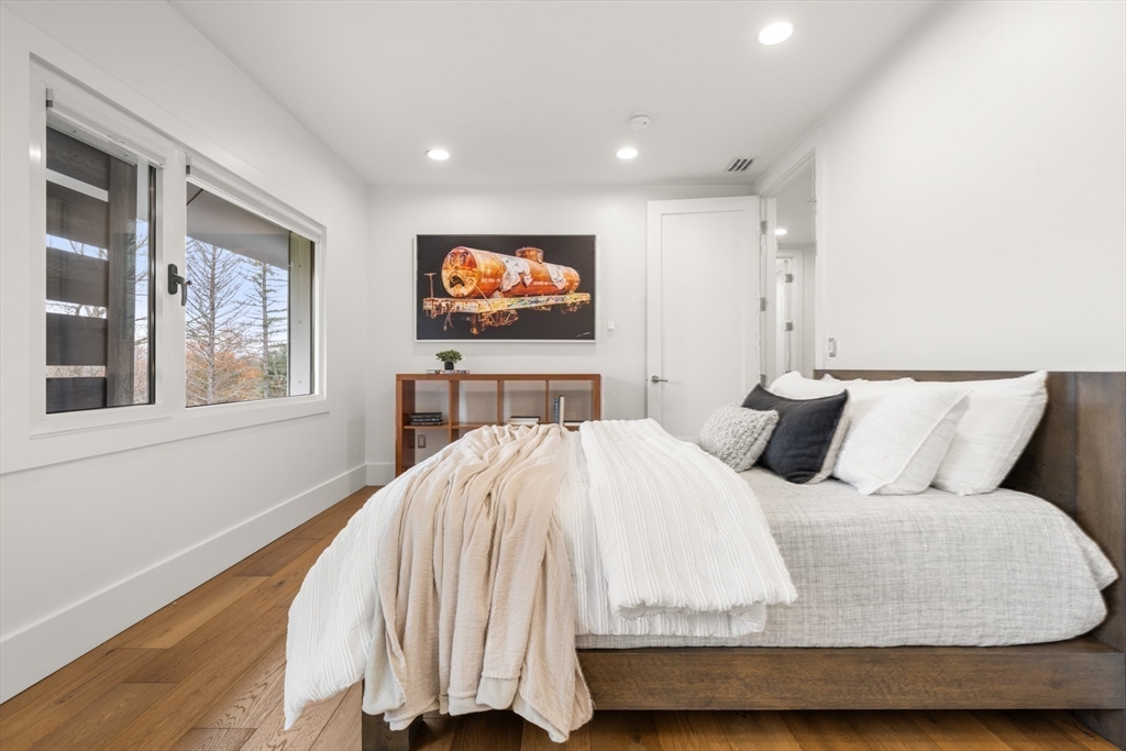 30 Whipple Road Lexington, MA 02420 - Photo 27 of 32 a bedroom with a bed and a flat screen tv