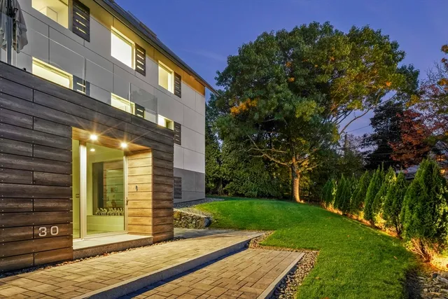 a view of a brick house with a yard