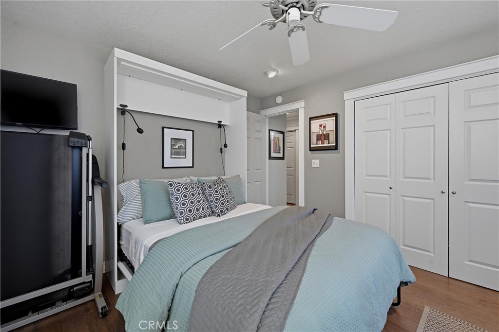 17432 Greenridge Road Hidden Valley Lake, CA 95467 - Photo 41 of 72 a bedroom with a large bed and a flat tv screen