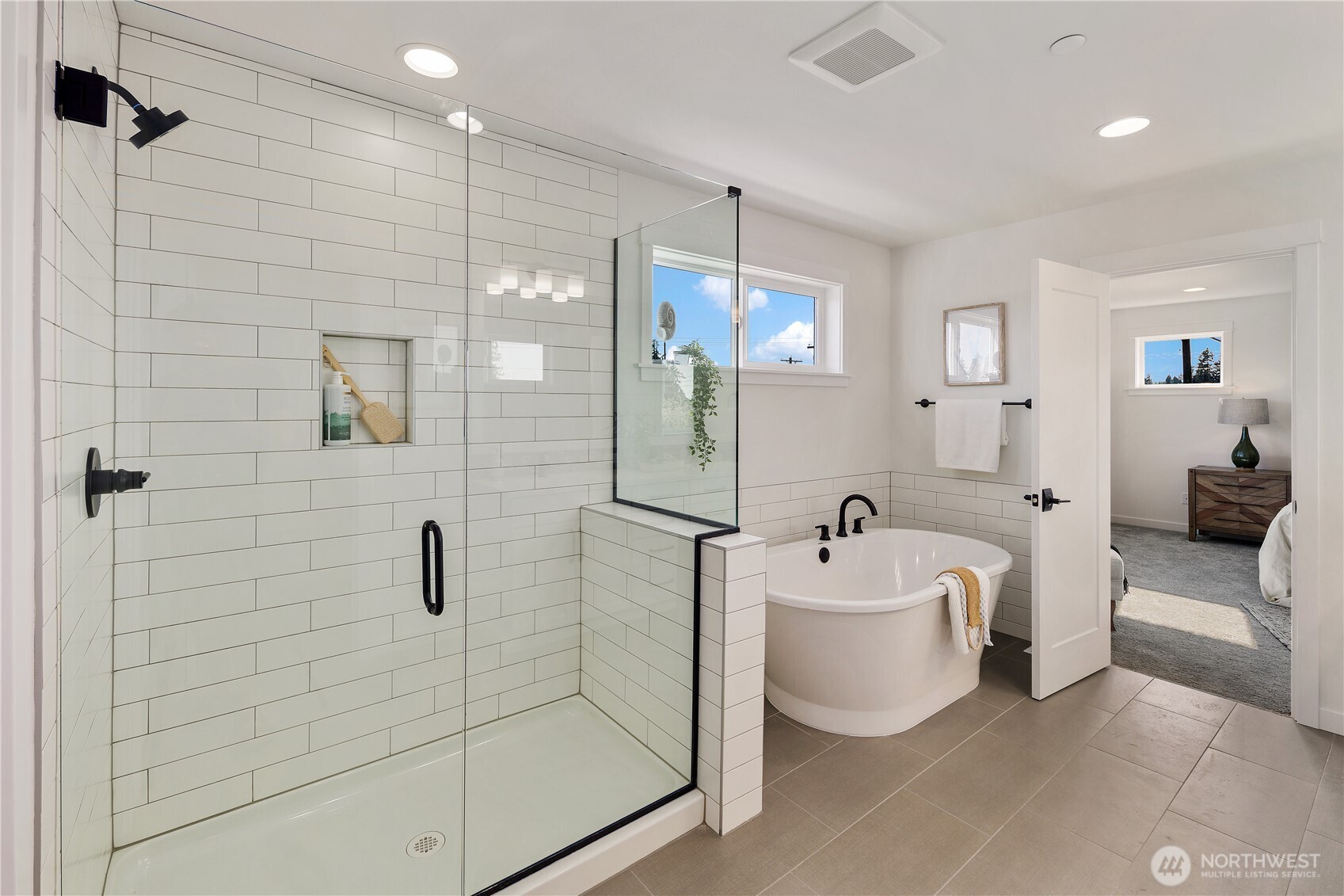 729 211th Place Southeast Bothell, WA 98021 - Photo 18 of 26 a spacious bathroom with a bathtub shower sink mirror and toilet