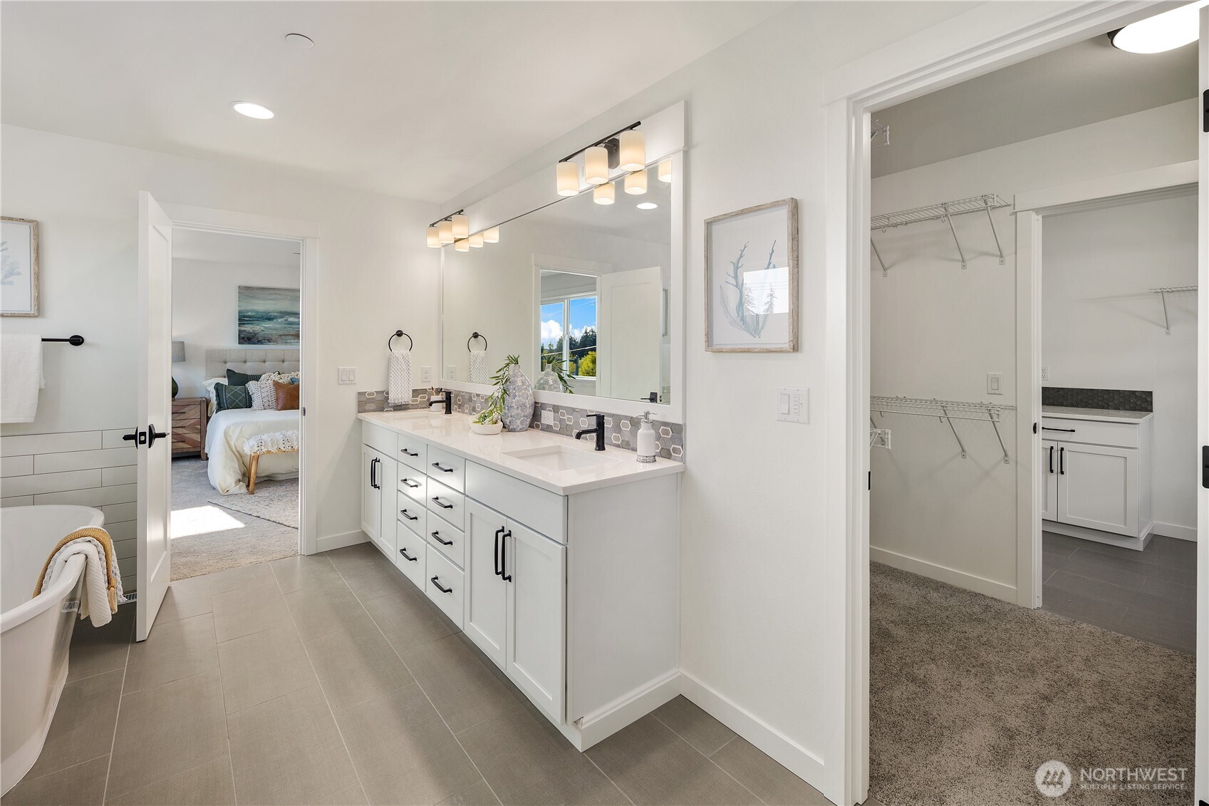 729 211th Place Southeast Bothell, WA 98021 - Photo 19 of 26 a bathroom with a double vanity sink a mirror and a bathtub