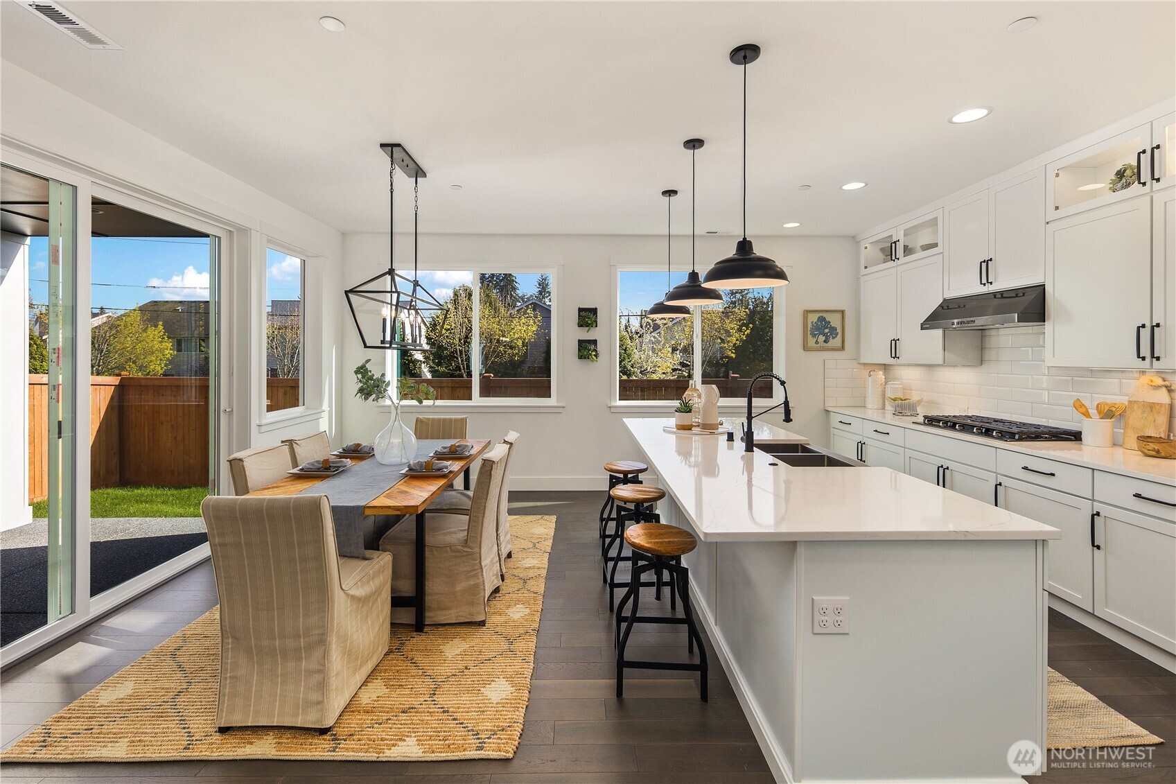 729 211th Place Southeast Bothell, WA 98021 - Photo 8 of 26 a large kitchen with kitchen island a large island in it