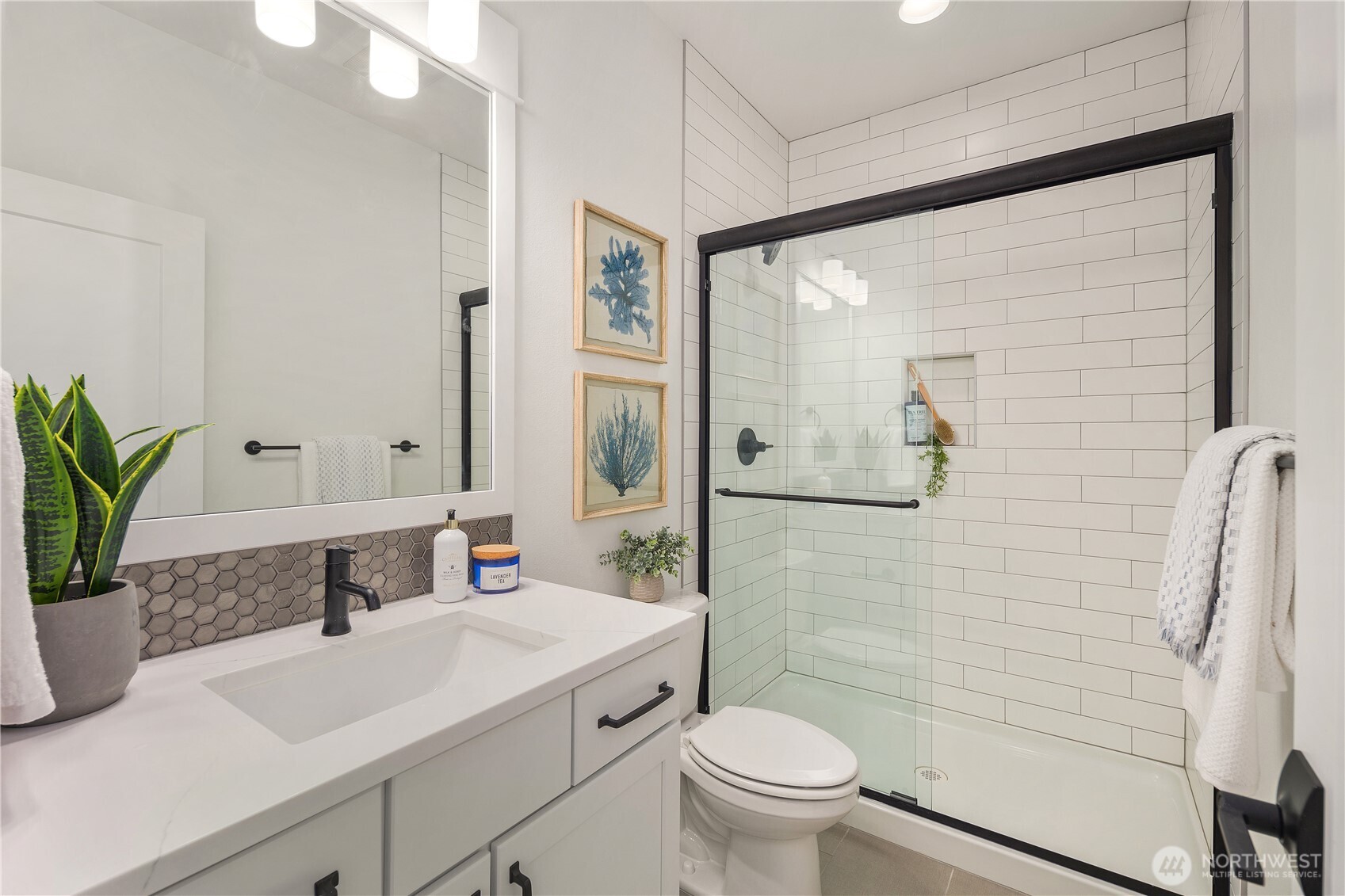 729 211th Place Southeast Bothell, WA 98021 - Photo 10 of 26 a bathroom with a sink toilet and shower