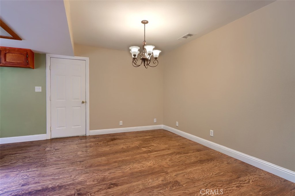 7115 Hites Cove Road Mariposa, CA 95338 - Photo 14 of 48 wooden floor in an empty room