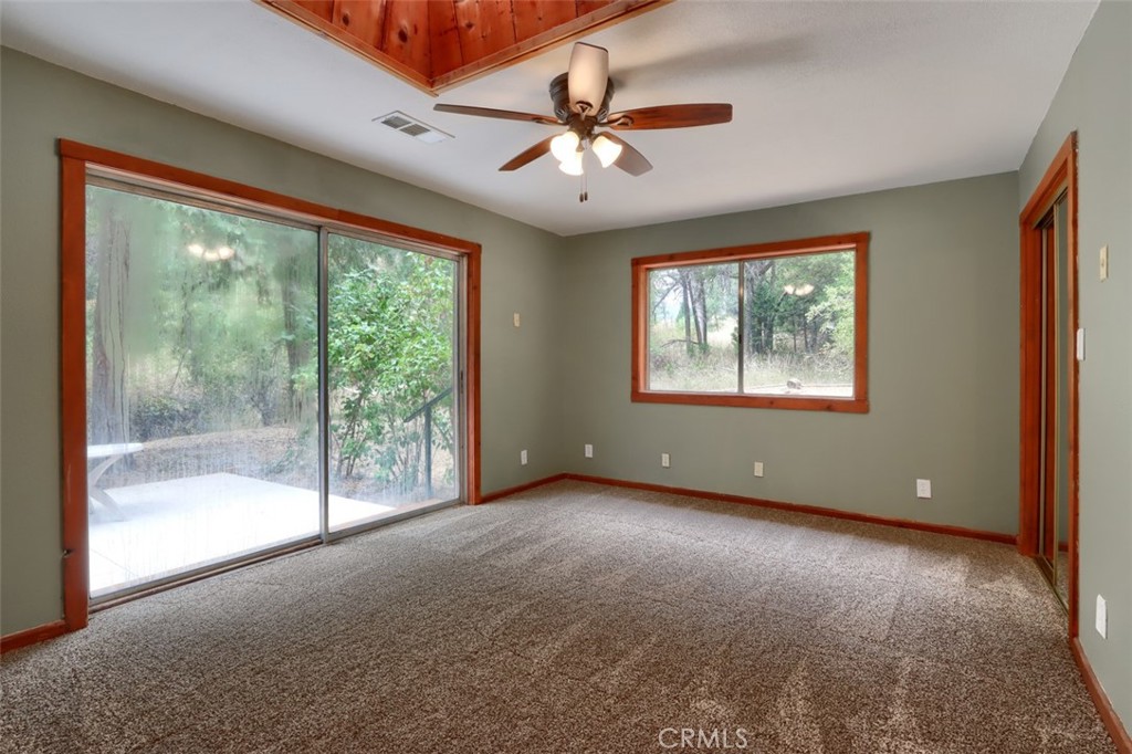 7115 Hites Cove Road Mariposa, CA 95338 - Photo 17 of 48 a view of an empty room with windows