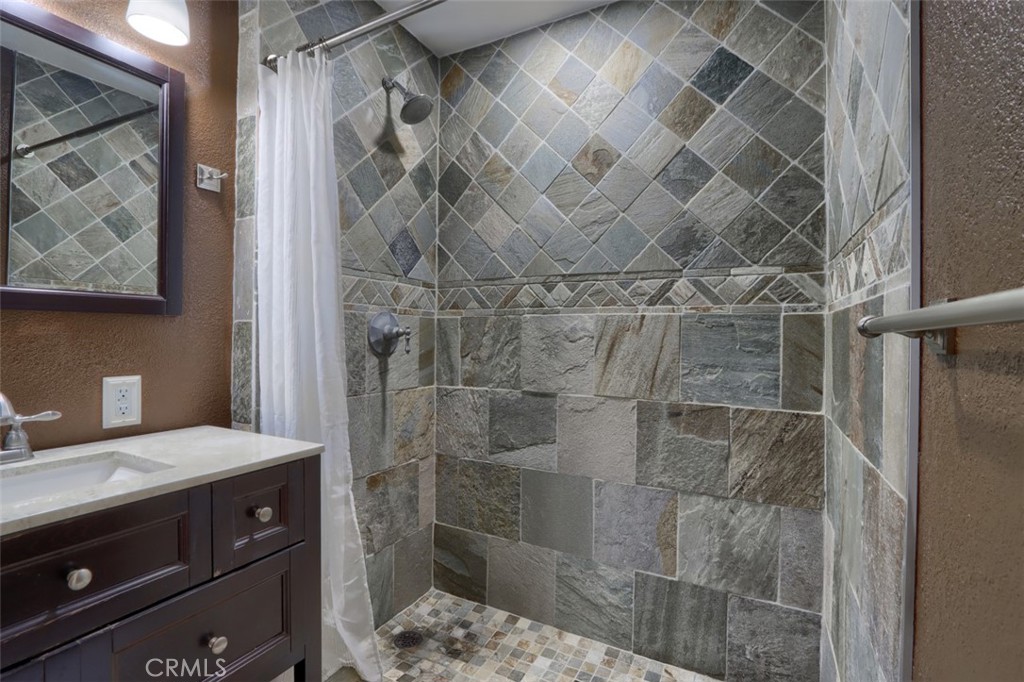 7115 Hites Cove Road Mariposa, CA 95338 - Photo 19 of 48 a bathroom with a shower and a sink