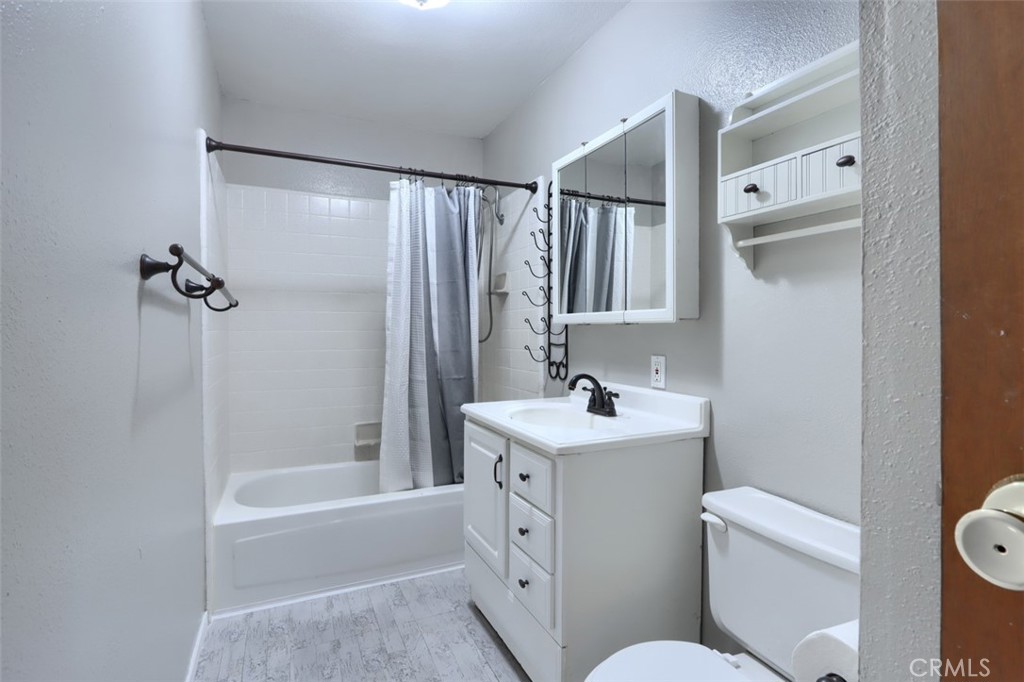 7115 Hites Cove Road Mariposa, CA 95338 - Photo 25 of 48 a bathroom with a sink toilet and shower