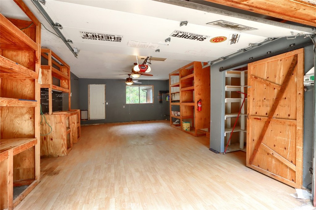 7115 Hites Cove Road Mariposa, CA 95338 - Photo 31 of 48 a view of empty room with wooden floor