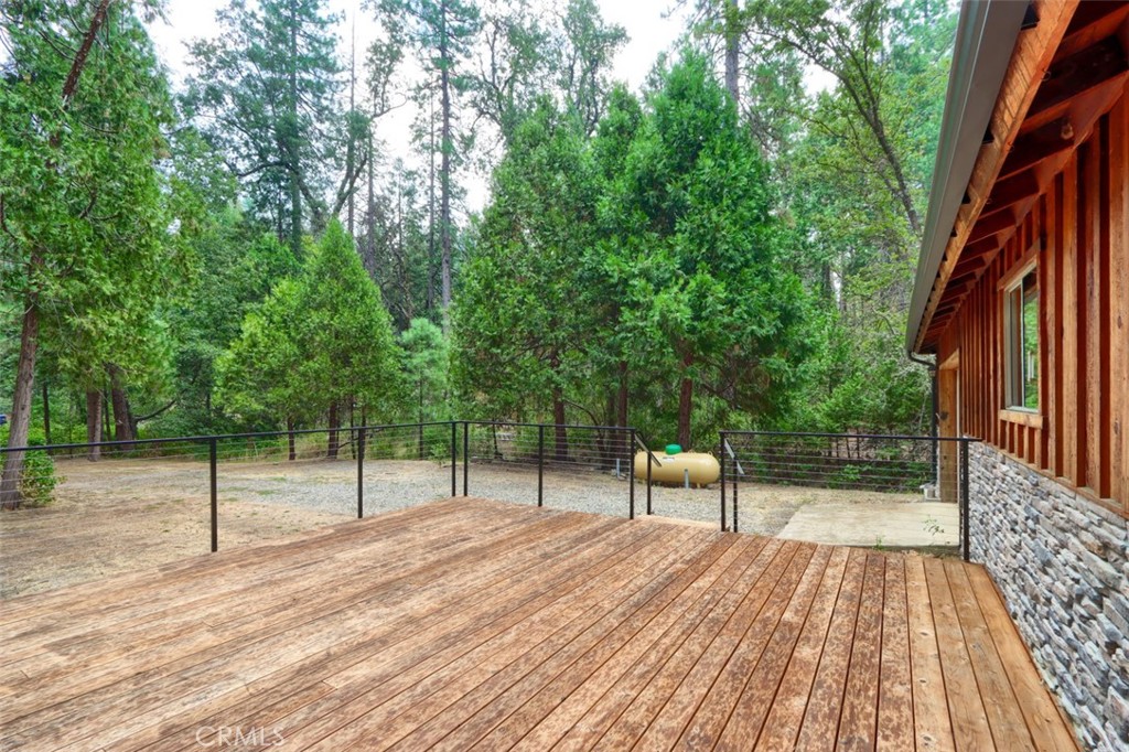 7115 Hites Cove Road Mariposa, CA 95338 - Photo 36 of 48 a view of a backyard with a deck