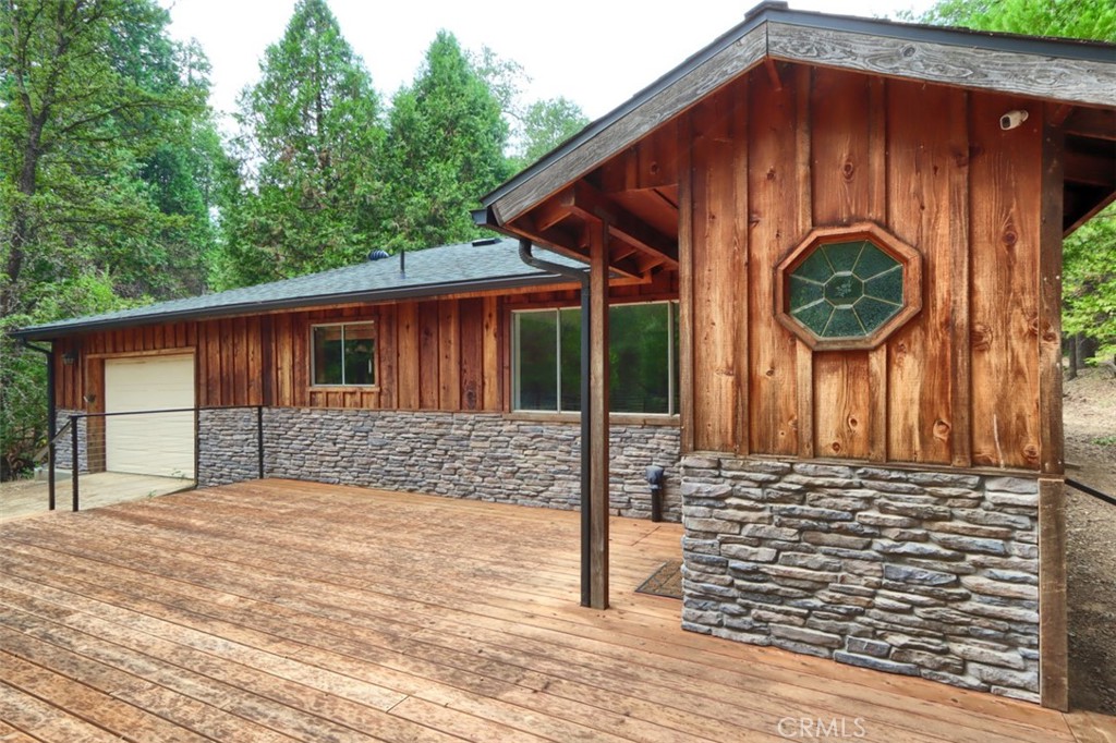 7115 Hites Cove Road Mariposa, CA 95338 - Photo 4 of 48 a front view of a house with garden