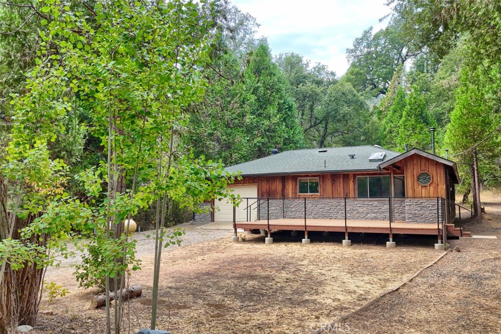 7115 Hites Cove Road Mariposa, CA 95338 - Photo 46 of 48 a view of a house with a yard and trees