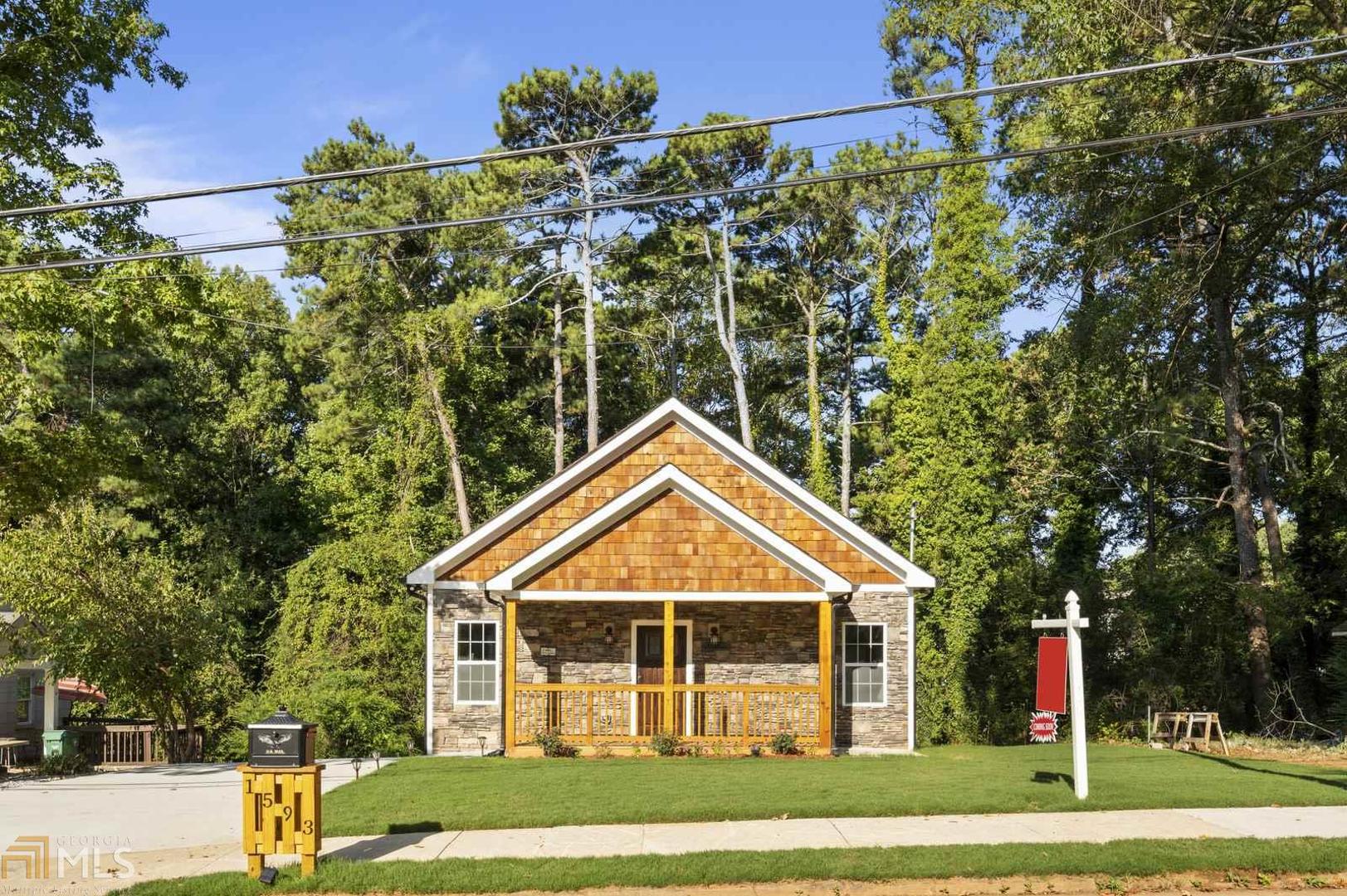 1593 Terry Mill Road Southeast, Unit 41 Atlanta, GA 30316 - Photo 1 of 1 a front view of a house with a yard