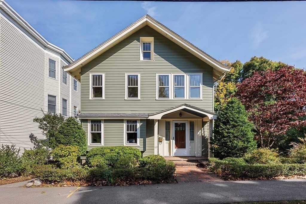 209 Reservoir Road Brookline, MA 02467 - Photo 1 of 24 a front view of a house with a yard