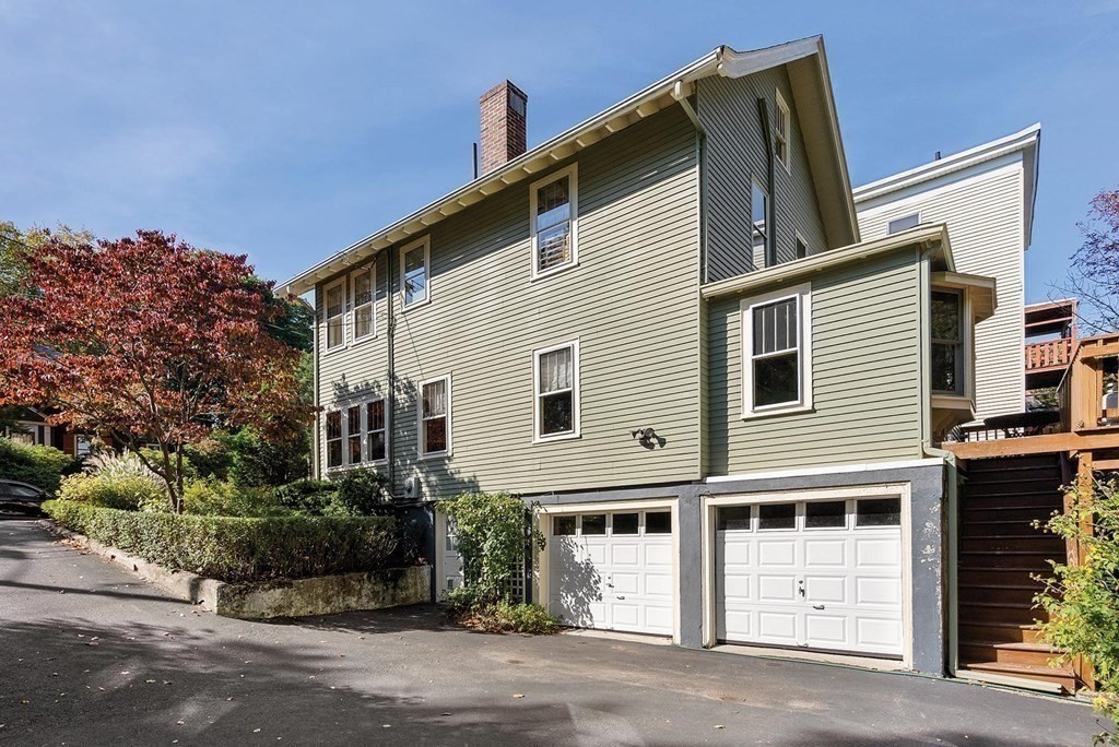 209 Reservoir Road Brookline, MA 02467 - Photo 18 of 24 a front view of a house with a parking space