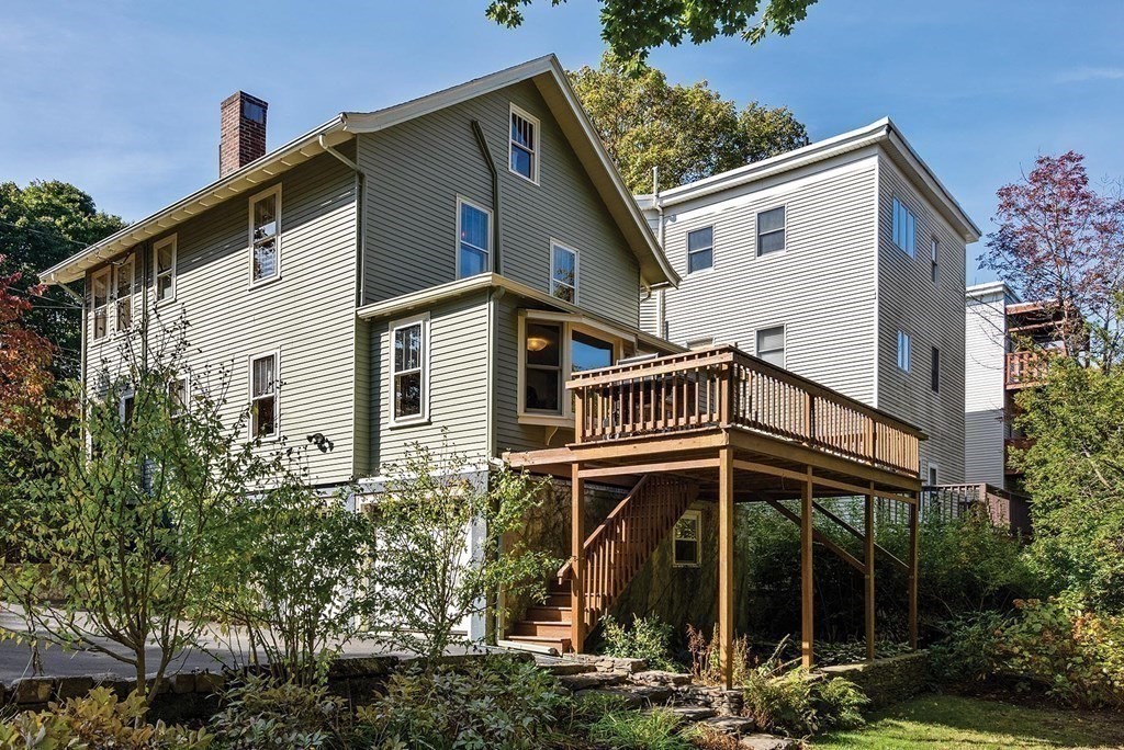 209 Reservoir Road Brookline, MA 02467 - Photo 19 of 24 a front view of a house with a yard