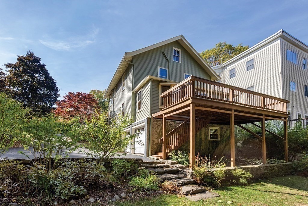 209 Reservoir Road Brookline, MA 02467 - Photo 20 of 24 a front view of a house with garden