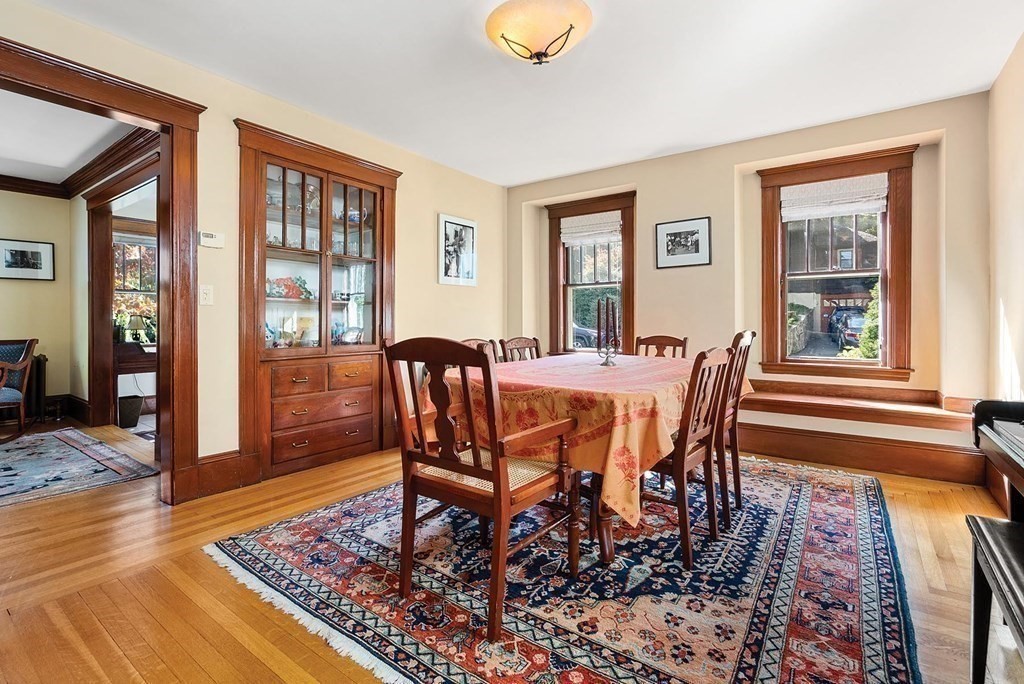 209 Reservoir Road Brookline, MA 02467 - Photo 5 of 24 a view of a dining room with furniture and wooden floor