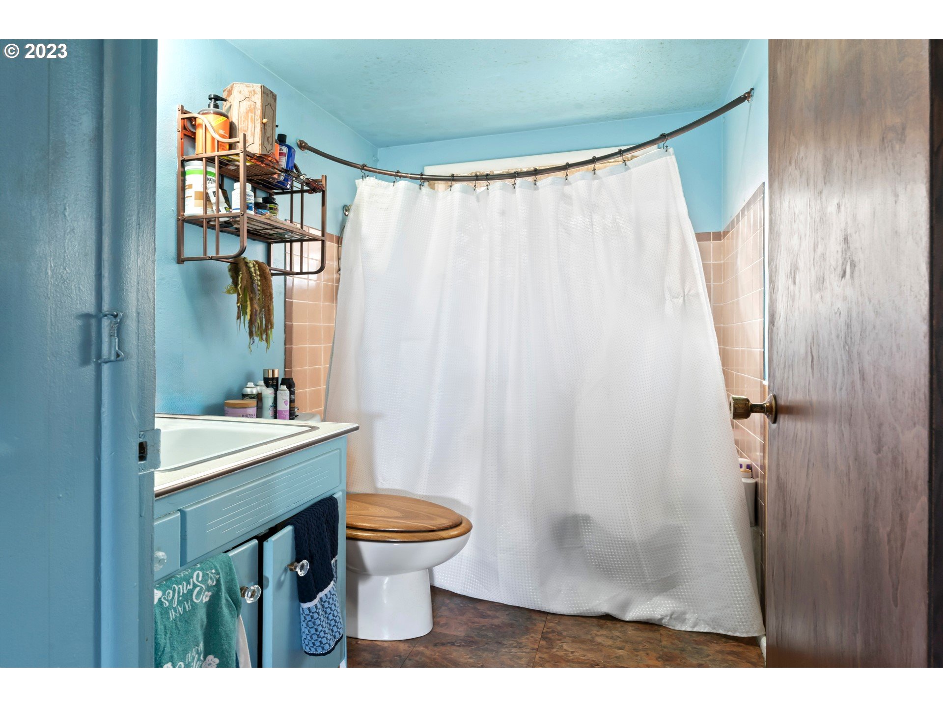855 D Street Springfield, OR 97477 - Photo 11 of 18 a bathroom with a sink a toilet and shower